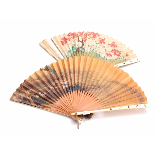 226 - TWO LATE 19TH CENTURY JAPANESE SHIBAYANA IVORY HANDLED FANS set with different raised insects to the... 