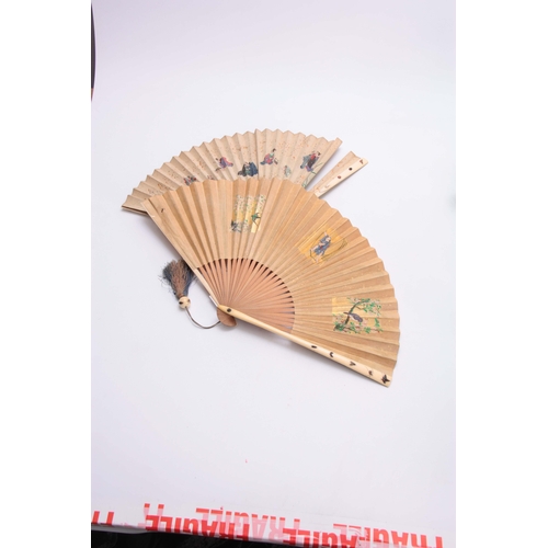 226 - TWO LATE 19TH CENTURY JAPANESE SHIBAYANA IVORY HANDLED FANS set with different raised insects to the... 