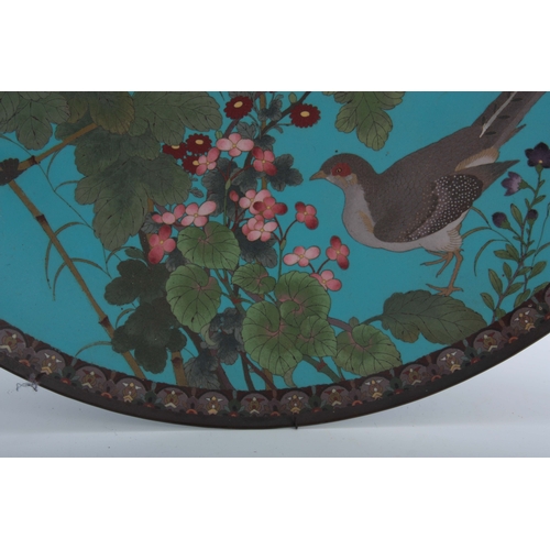 231 - A LARGE LATE 19th CENTURY JAPANESE CLOISONNE CHARGER having a blue ground with bird and butterfly on... 