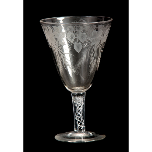 6 - AN 18TH CENTURY STYLE GLASS GOBLET Circa 1880 with a flat foot, multi-spiral air twist stem and flar... 