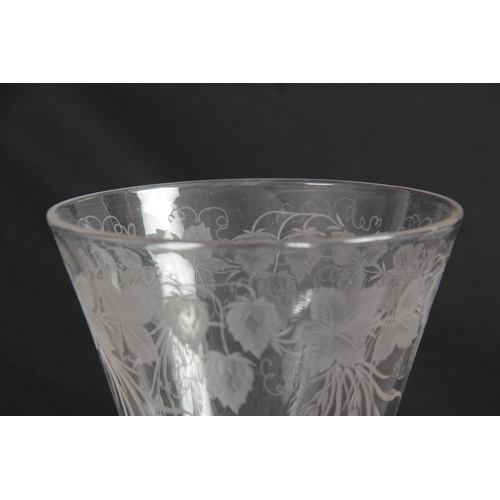 6 - AN 18TH CENTURY STYLE GLASS GOBLET Circa 1880 with a flat foot, multi-spiral air twist stem and flar... 