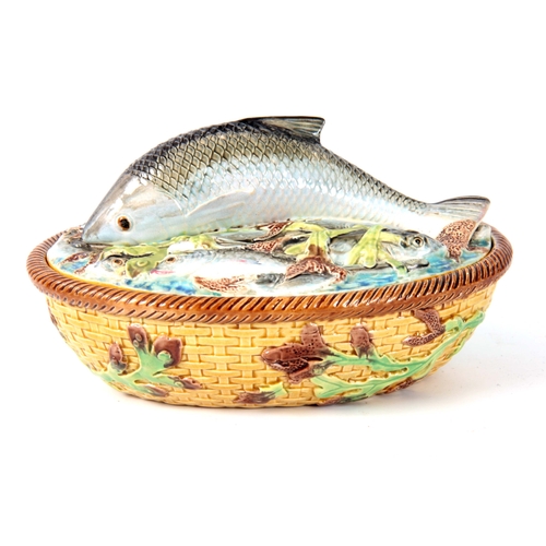 66 - A LATE 19th CENTURY MAJOLICA SARDINE DISH AND COVER IN THE MANNER OF GEORGE JONES the oval lid surmo... 