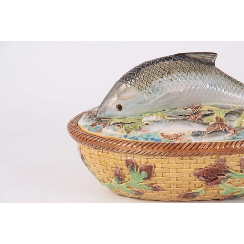 66 - A LATE 19th CENTURY MAJOLICA SARDINE DISH AND COVER IN THE MANNER OF GEORGE JONES the oval lid surmo... 