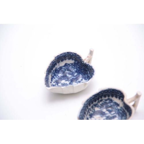 75 - AN EARLY PAIR OF BLUE AND WHITE LEAF SHAPED PEARLWARE PICKLE DISHES with oriental landscape decorati... 