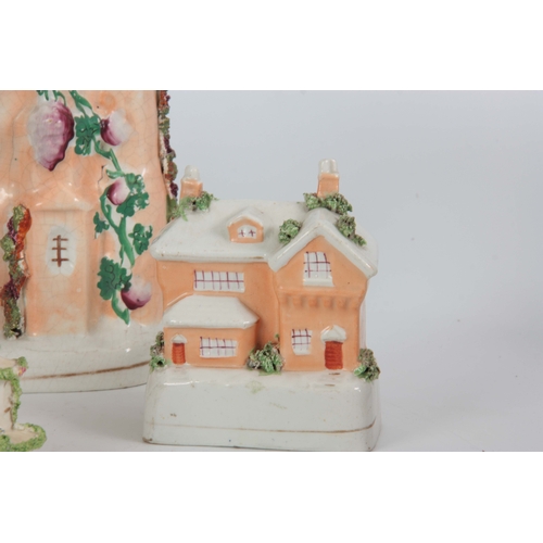 99 - A SELECTION OF FOUR 19TH CENTURY STAFFORDSHIRE HOUSE FIGURINES comprising of one with clocktower - 2... 