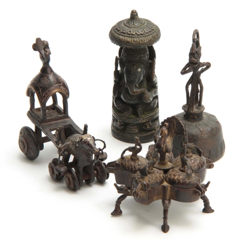 234 - A GROUP OF FOUR EASTERN CAST BRONZE TEMPLE TOYS depicting elephants, peacocks and a bell 13.5cm high... 