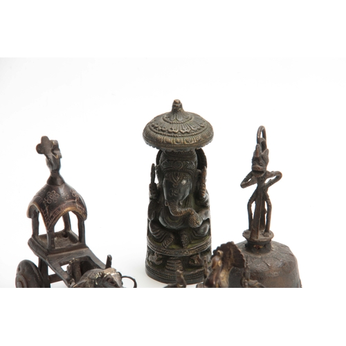 234 - A GROUP OF FOUR EASTERN CAST BRONZE TEMPLE TOYS depicting elephants, peacocks and a bell 13.5cm high... 