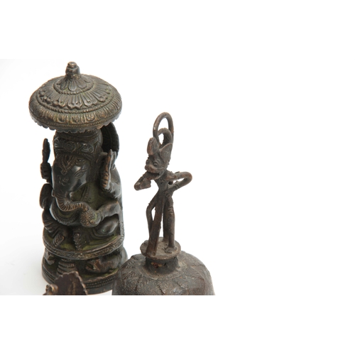 234 - A GROUP OF FOUR EASTERN CAST BRONZE TEMPLE TOYS depicting elephants, peacocks and a bell 13.5cm high... 