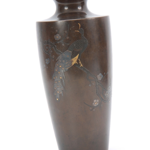 235 - A JAPANESE MEIJI PERIOD BRONZE AND INLAID MIXED METAL TAPERING VASE depicting a peacock sat in branc... 