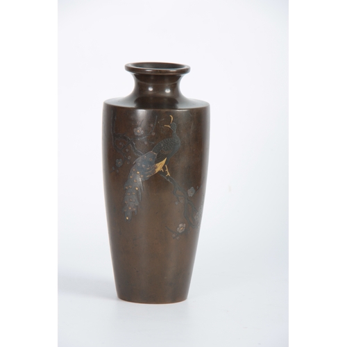 238 - A JAPANESE MEIJI PERIOD BRONZE AND INLAID MIXED METAL TAPERING VASE depicting a peacock sat in branc... 