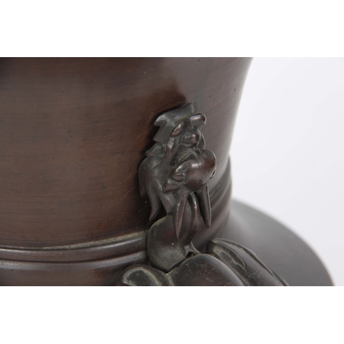 239 - AN 18TH / 19TH CENTURY CHINESE BRONZE VASE having a tapering rim and shaped foot, mounted with drago... 