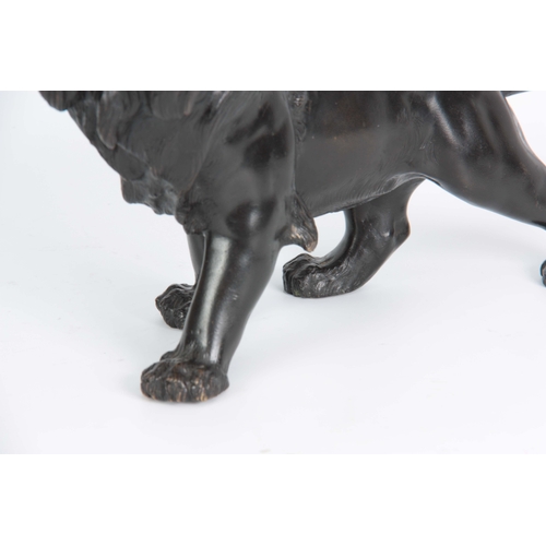 250 - A JAPANESE MEIJI PERIOD PATINATED BRONZE SCULPTURE modelled as a lion with amber glass eyes, charact... 