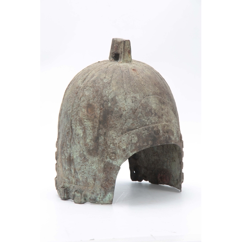 251 - A CHINESE BRONZE HELMET, PROBABLY HAN DYNASTY 206BC- 220AD, with angular lug surmounting a ribbed cr... 