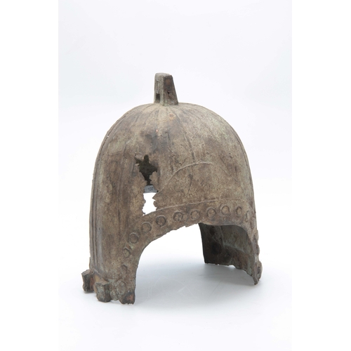 251 - A CHINESE BRONZE HELMET, PROBABLY HAN DYNASTY 206BC- 220AD, with angular lug surmounting a ribbed cr... 