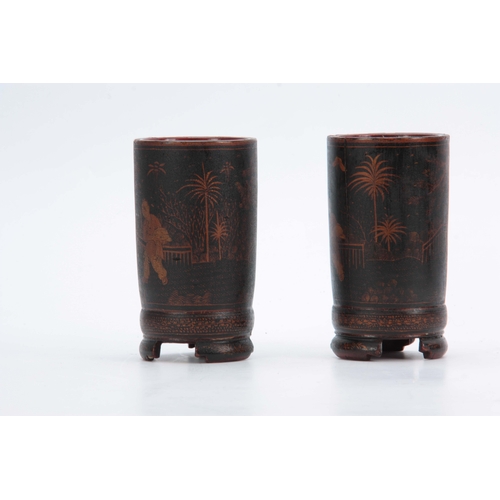 265 - A PAIR OF 18TH CENTURY CHINESE LACQUER WORK BRUSH POTS decorated with continuous figural garden scen... 