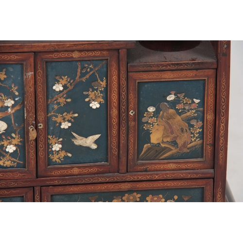 281 - A JAPANESE MEIJI PERIOD COLLECTORS CABINET having fine Chinoiserie decorated panels inlaid with moth... 