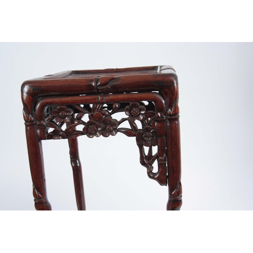 291 - A SMALL 19th CENTURY CHINESE HARDWOOD PLANT STAND of simulated bamboo design with pierced floral fre... 