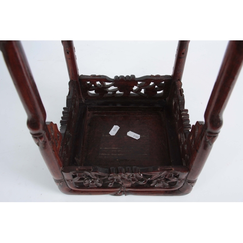 291 - A SMALL 19th CENTURY CHINESE HARDWOOD PLANT STAND of simulated bamboo design with pierced floral fre... 