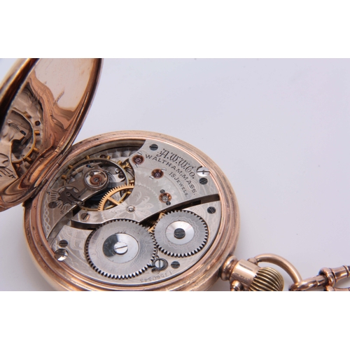 370 - A 9CT GOLD FULL HUNTER WALTHAM POCKET WATCH WITH 9CT GOLD FOB the spring-loaded hinged cover opening... 