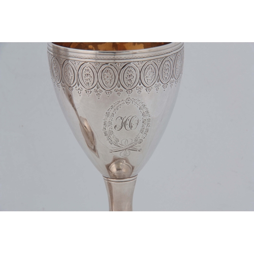 372 - A FINE PAIR OF LATE 18th CENTURY SILVER AND GILT GOBLETS having bright cut foliate engraved decorati... 