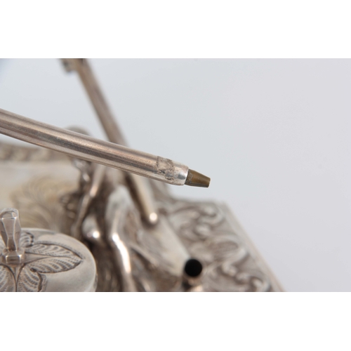 377 - AN EARLY 20TH CENTURY CONTINENTAL SILVER DESK STAND / INKWELL of classical design with leaf cast mou... 