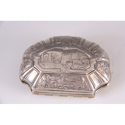 384 - AN 18TH CENTURY CONTINENTAL SILVER PILL BOX of scalloped form depicting a religious scene to the hin... 