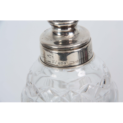 390 - AN EDWARD VII SILVER MOUNTED HEAVY CUT GLASS COCKTAIL SHAKER with pull-off top. Birmingham 1902 toge... 