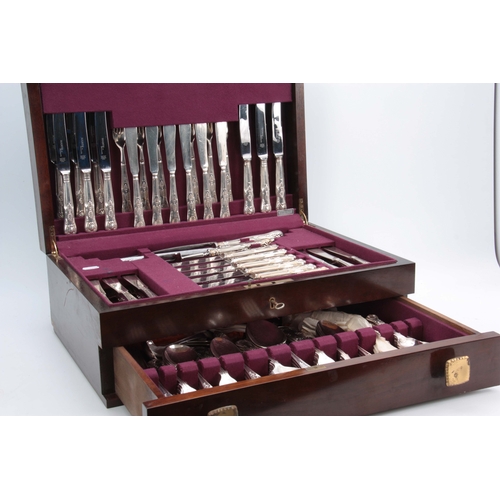 394 - A COMPREHENSIVE CASED TWELVE PIECE SETTING OF QUEENS PATTERN SILVER PLATED CUTLERY in fitted Mahogan... 