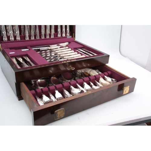 394 - A COMPREHENSIVE CASED TWELVE PIECE SETTING OF QUEENS PATTERN SILVER PLATED CUTLERY in fitted Mahogan... 