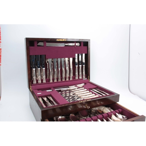 394 - A COMPREHENSIVE CASED TWELVE PIECE SETTING OF QUEENS PATTERN SILVER PLATED CUTLERY in fitted Mahogan... 