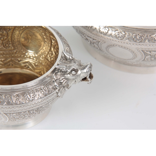 401 - A VICTORIAN SILVER AND GILT CREAM JUG AND SUGAR BOWL  having relief scroll-work panels and fine engr... 