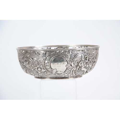 403 - A FINE 18th/19TH CENTURY IRISH SILVER PIERCED AND REPOSE BOWL decorated with a leprechaun, birds and... 