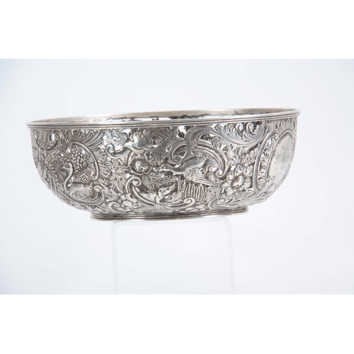 403 - A FINE 18th/19TH CENTURY IRISH SILVER PIERCED AND REPOSE BOWL decorated with a leprechaun, birds and... 