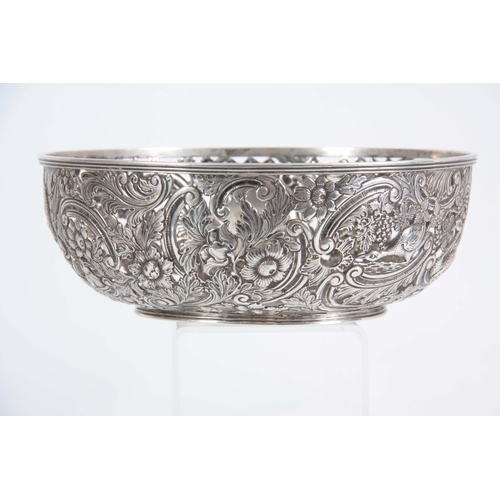 403 - A FINE 18th/19TH CENTURY IRISH SILVER PIERCED AND REPOSE BOWL decorated with a leprechaun, birds and... 