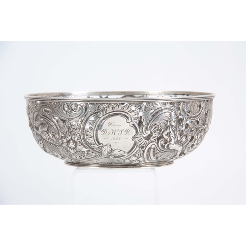 403 - A FINE 18th/19TH CENTURY IRISH SILVER PIERCED AND REPOSE BOWL decorated with a leprechaun, birds and... 