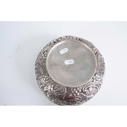 403 - A FINE 18th/19TH CENTURY IRISH SILVER PIERCED AND REPOSE BOWL decorated with a leprechaun, birds and... 