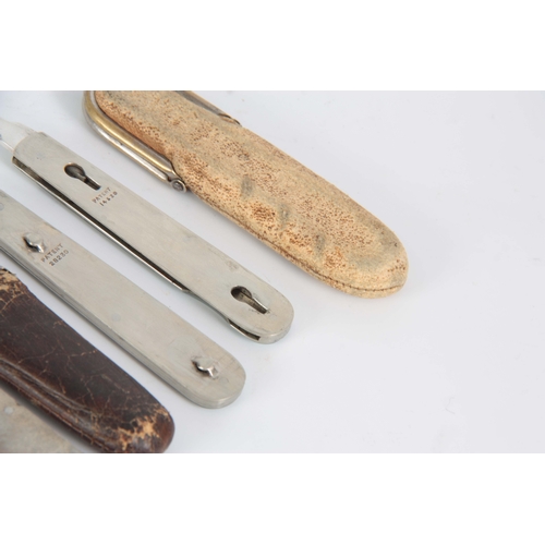 415 - A SELECTION OF THREE EARLY 20TH CENTURY FOLDING FRUIT KNIFE AND FORKS with a split mechanism to sepa... 