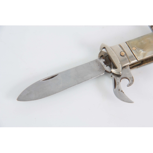 416 - A VINTAGE SPANISH GENTLEMANS MULTI-FUNCTION HUNTING KNIFE with simulated mother of pearl handle havi... 