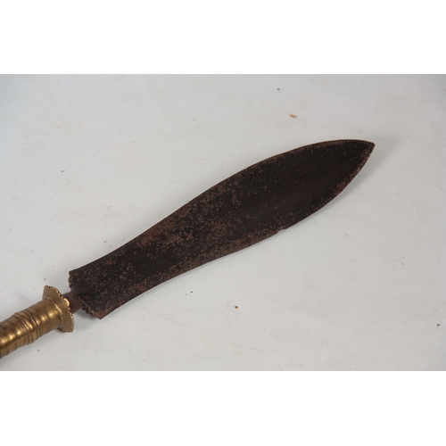 423 - A 19TH CENTURY AFRICAN TRIBAL SPEAR with flattened iron blade and ringed brass shank on a heavy tape... 