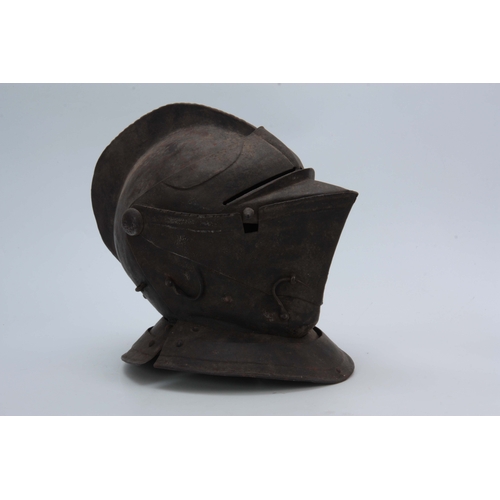 431 - A CLOSE HELMET with a one-piece skull and comb, and hinged visor 31cm high