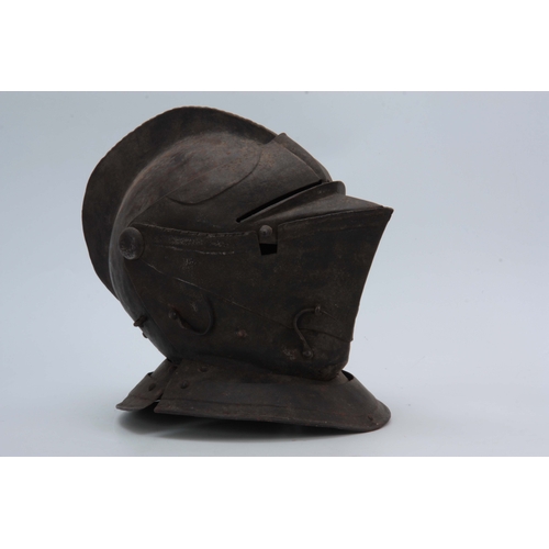 431 - A CLOSE HELMET with a one-piece skull and comb, and hinged visor 31cm high