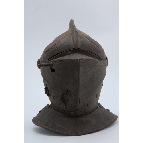 431 - A CLOSE HELMET with a one-piece skull and comb, and hinged visor 31cm high