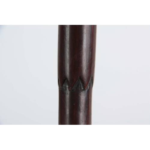 439 - A 19TH CENTURY ROSEWOOD WALKING STICK of tapering form with carved figuratively pommel depicting a b... 