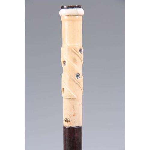 440 - A LATE 19TH CENTURY GENTLEMANS WALKING CANE with mother of pearl inlaid twisted ivory handle and mah... 