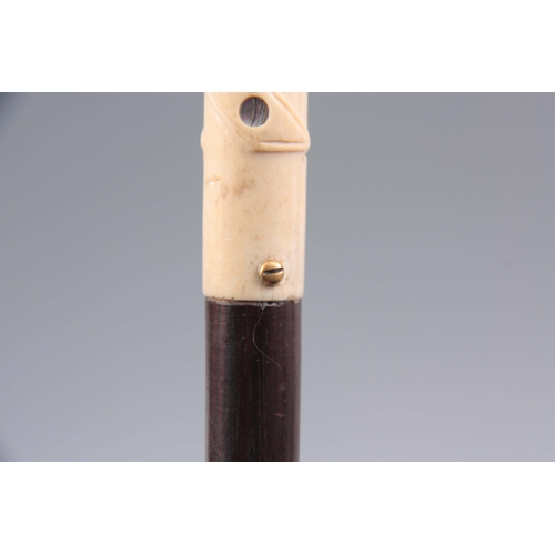 440 - A LATE 19TH CENTURY GENTLEMANS WALKING CANE with mother of pearl inlaid twisted ivory handle and mah... 