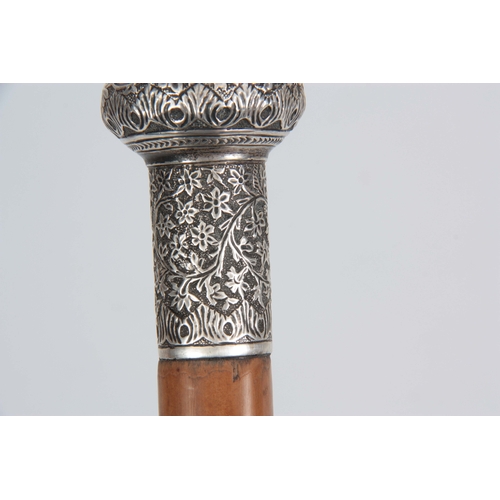 442 - A 19TH CENTURY MALACCA AND WHITE METAL SWORD STICK with tapering cane shaft and floral repousse work... 