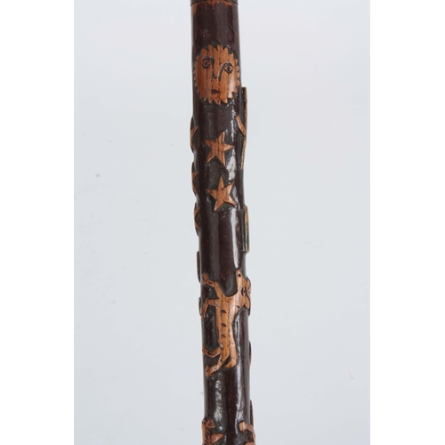 444 - A LATE 19th CENTURY SWORD STICK the fruitwood handle with carved animals head having a brass hinged ... 