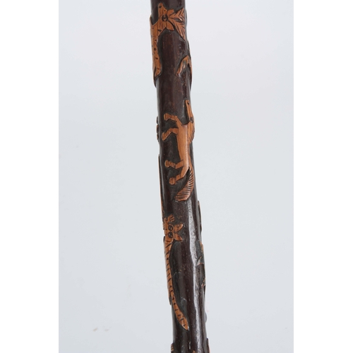 444 - A LATE 19th CENTURY SWORD STICK the fruitwood handle with carved animals head having a brass hinged ... 