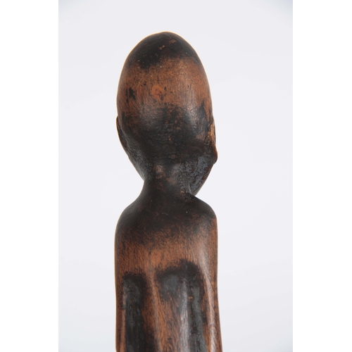 449 - AN AFRICAN CARVED EBONISED WALKING CANE the handle modelled as a seated figure 96cm overall