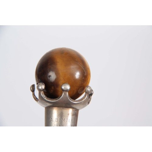 451 - A LATE 19th CENTURY ROSEWOOD WALKING CANE with spherical tigers eye handle on crown style mount, ins... 